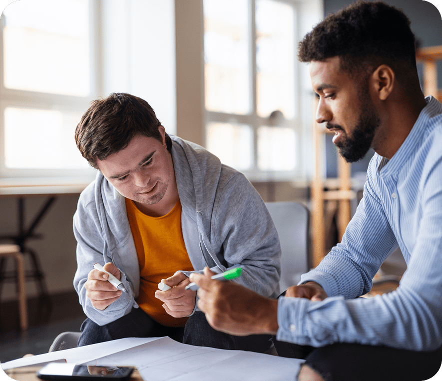 Colleagues discussing ideas at a table